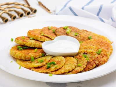 Traditional Hanukkah dish latkes - potato pancakes with sour cream with
